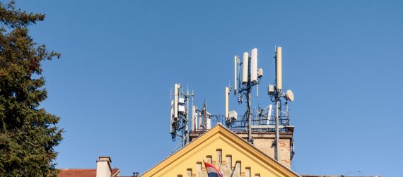 mobile-network-cell-tower-on-top-of-building-in-ci-2022-11-14-18-01-12-utc